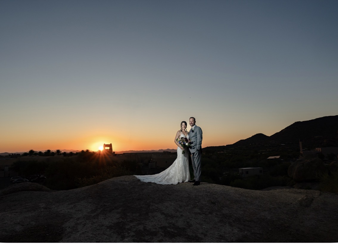 Desert sunset over mountain silhouettes